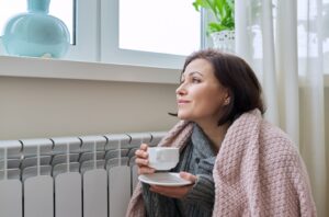 woman staying warm inside